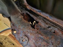 Found a pocket of rust after pulling the pan out.  Did realize that in the passenger side and drivers side there is a hole for water to get in between the outer shell and the inner on the rocker panel.  This was a mess.  I cut this out and cleaned it up.