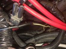 White wire looping and diving deep into engine? Exhaust?
