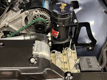 Remote power steering reservoir with two return inlets.