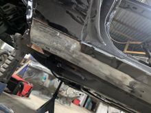 Clean patch in place.  This was done on both side to repair the leading edge of the rocker on the driver's side and fix the major dents where people decided it was a good idea to jack up the car by the rocker.