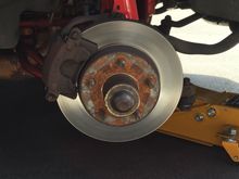 Before: Factory 10", single-piston , iron calipers.