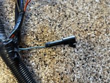 This first connector with a gray wire, I don’t have on my original harness. What is this? 