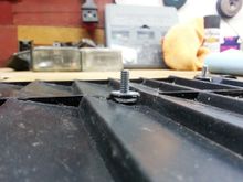 Epoxy in the hole, then the bolt, and finally a tight fitting metric washer to sandwich it all in there and help keep it all upright.