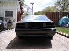A little dark but showing the spoiler, exhaust, and black out lights