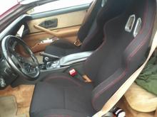 New racing seats, new door panels, carpet, and trim parts in black are next for the interior.