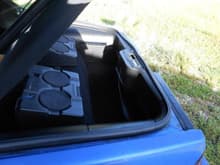 This is a pic of my trunk with newer black plastics (it was tan), a rollout cover and my speakers. They're some kind of pioneer speakers made for trucks, and they do the job.