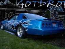 outside back showing the custom exhaust and back end we built.  system kept rattling the tail lights so we had to make a custom back end to eliminate that problem.