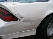 The PO screwed a 2x4 into the rear quarter panel to try and make a homemade dent puller. As you can see all he got was an epic fail. He then shot a coat of paint over it to &quot;hide&quot; the primer and fiberglass.