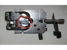 That lever must be there or the pull-down unit will not release the hatch hook when it reaches the end of the up cycle