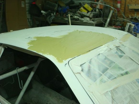 First coat of bondo passenger side. It looks like a lot but its fairly thin.