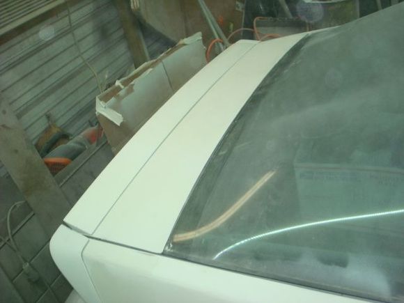 Spoiler is just setting in place. I will probably raise it with washers when painting the car just to have clean lines.