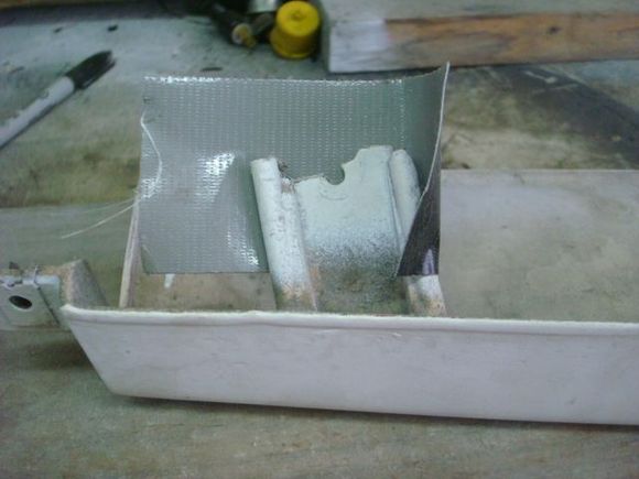 Missing part of 1 lower mount bracket.