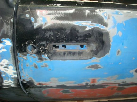 Passenger side door handle, lock and mirror removed.