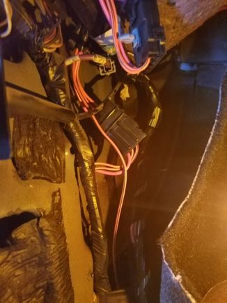 I dont see a main connector here under the kick panel. It goes straight to the fuse block.