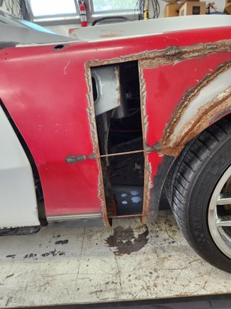 The front fenders were the big challenge, as they have had the wheel opening moved forward 5" and flared out 2". Lots of weld seems to blend in. Also notice the large, uneven gap between door and fender.