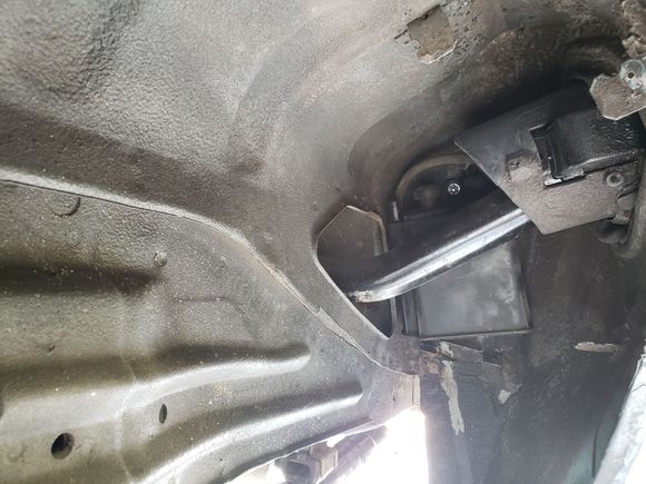 I didn't want to run another line to front of car for evap canister so used a foxbody mustang one.I trimmed the bracket and mounted it behind filler neck 