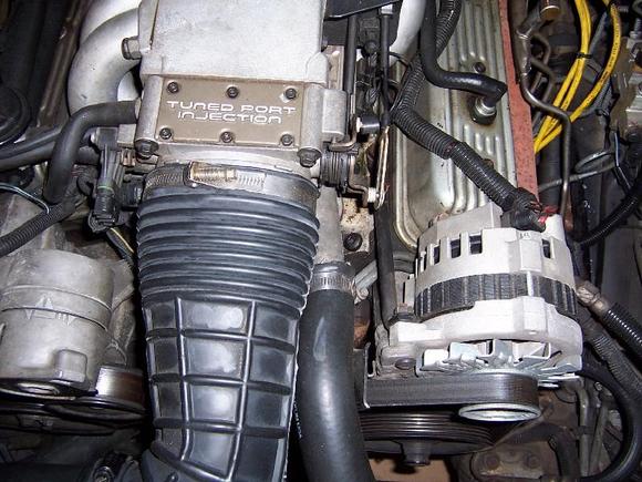 Inside alt to intake manifold 