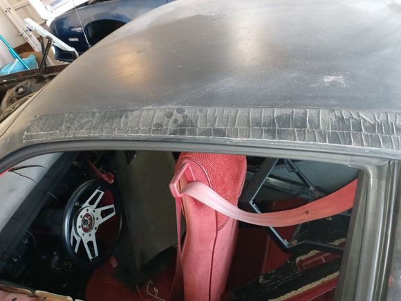 Rust holes were covered with tape to prevent water from getting inside the car.