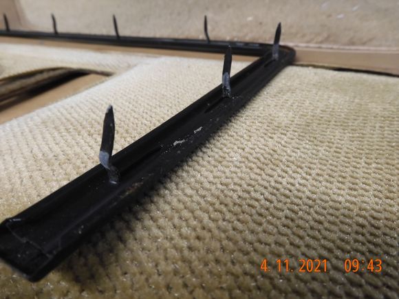 Impressive spike strips to hold the trim piece in