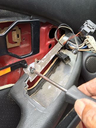 Drilling holes. I used the three 4th gen screw holes to securly fasten the panel to the door. Other smaller screws were used around the perimiter of the panel.