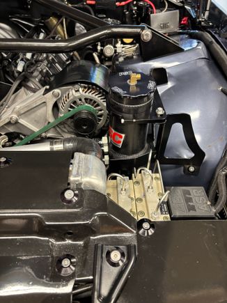Remote power steering reservoir with two return inlets.