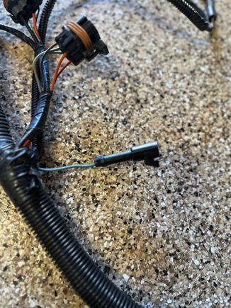 This first connector with a gray wire, I don’t have on my original harness. What is this? 
