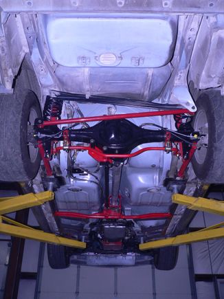 Modified Edelbrock torque arm for Heim's joint on front to get away from a trans mounted arm.