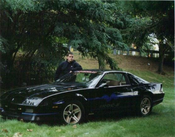 This is me and my Iroc around 2001 when I graduated high school.  I wish she still looked this good...