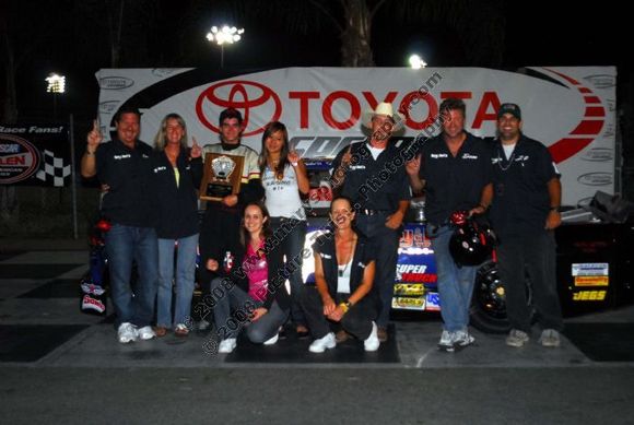 Some of the team and family in the winners circle.