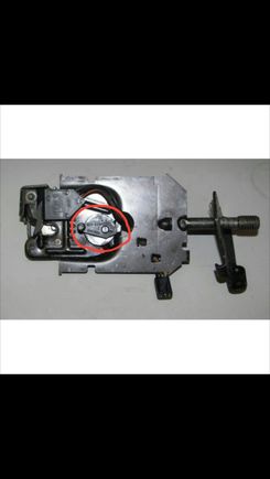 That lever must be there or the pull-down unit will not release the hatch hook when it reaches the end of the up cycle