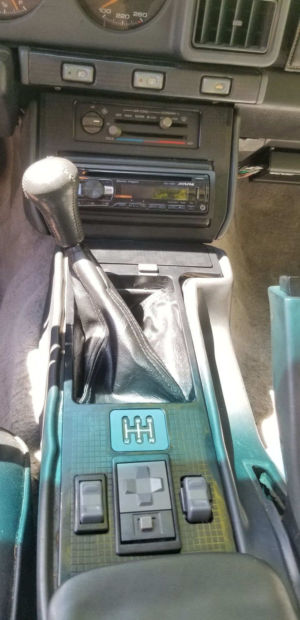 All installed!  Need bezels for two of those switches, but everything fits great!  Transmission is in 1st in this pic, definitely close to the console plate, but does not come into contact