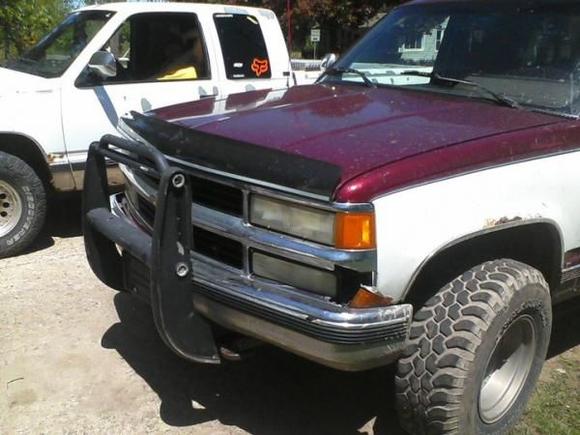 well im gonna have to wait for a while to get the grill fixed eather that or tape it for now 
this thing barley has any rust lots of dents but hardley anyrust i jsut put soem off road lights on the grill guard today more pictures to come
the whit truck in the background is my brothers gmc 4wd z71 towpakage truck hes got 31 inch discovery cooper sttts but they are damn near and some are bald
