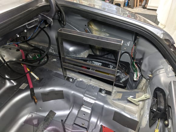 Moving to the trunk, I made a mount to stack both of my audio amplifiers in the trunk and still retain my space saver spare. This should allow for plenty of ventilation for the amps as well.