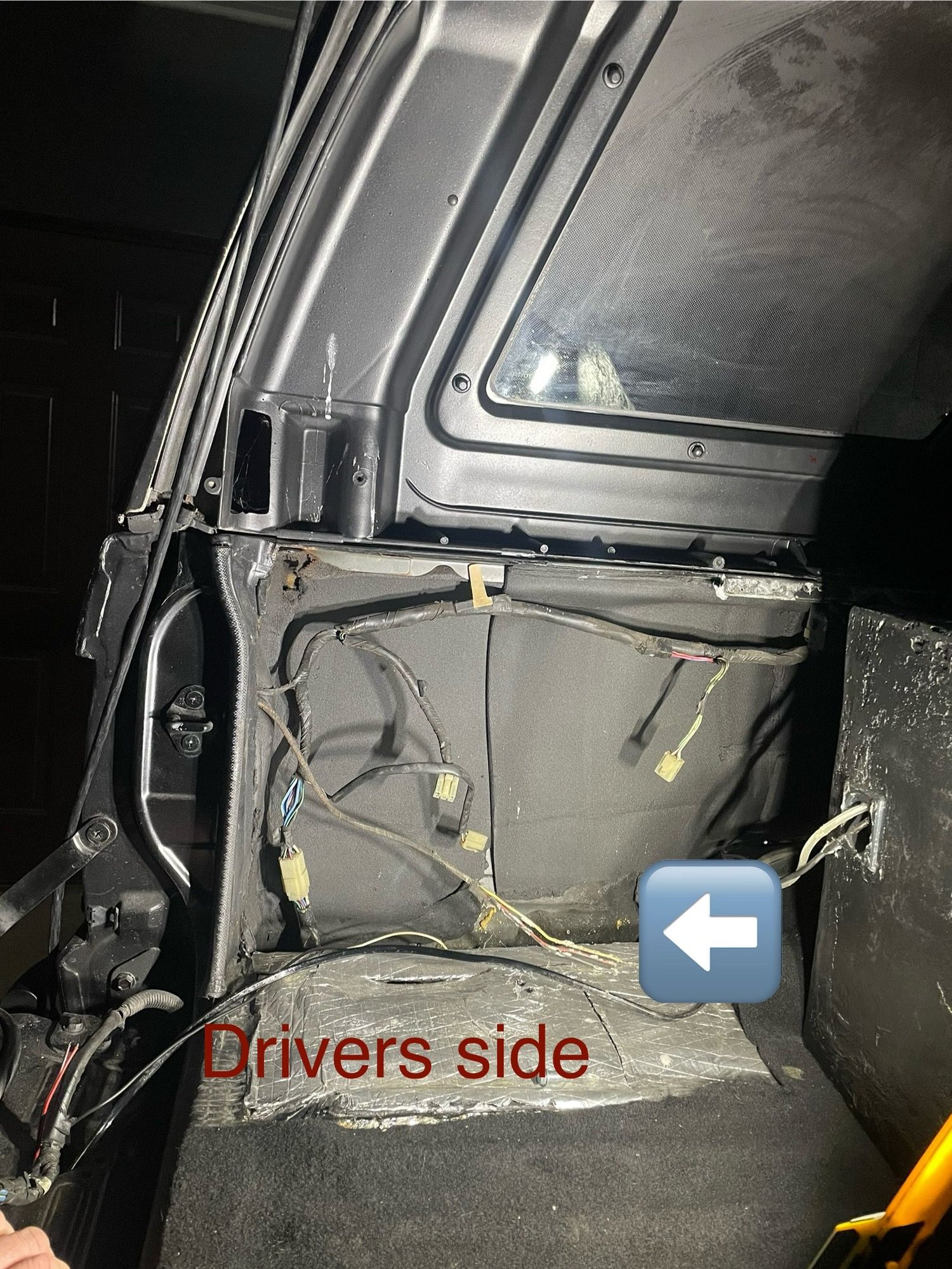 Arrow is pointing to 3 wires that were buried in spray foam insulation.  Have no idea where they go.  