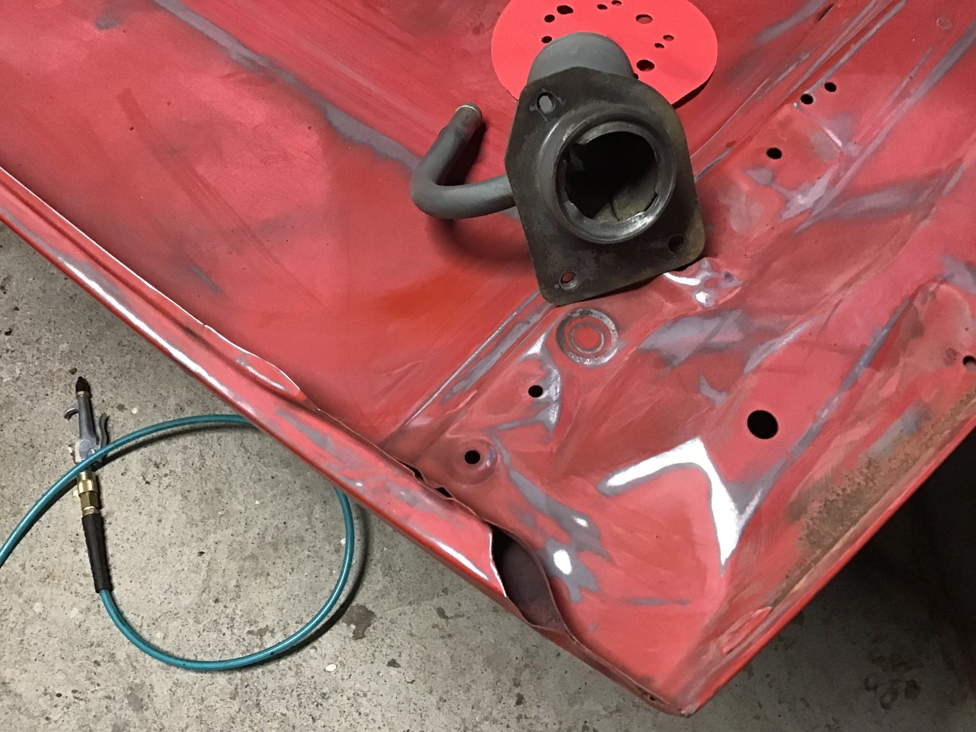 Removing the fuel filler steel hose section was a bear. All three screws needed to be drilled out. I think they�ll get replaced with stainless Allen screws or hex bolts. 