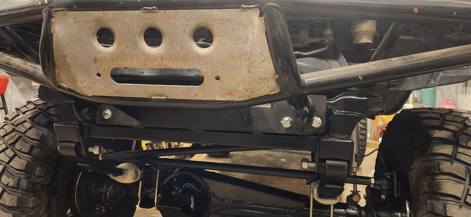 Front bumper back on. The bolts that came out were a little chewed up so i picked up some new flanged bolts. Threads on the 4 across the front cross member are M12x1.75.