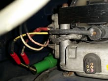 The original ignitor (ignition control module) was cut off and this other one was screwed to the side of it, and wires spliced from there.