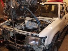 Attempted to put drop motor with out a body lift. Which was a mistake. Was able to slide the motor in with out cutting the front radiator support which was a big plus. However once the motor was in, it was very difficult to get the trans high enough to line up with the motor. Even with motor sitting on the steering well below the motor mounts. So I pulled the 2inch body lift off the black and put on this one. Following day every thing bolted up pretty smooth.