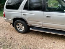 Dent in rear passenger door 