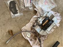 New parts and caliper put together with all hardware 