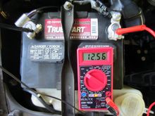 Example of how to measure battery voltage. 12.56 volts on my battery.