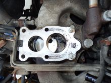 Intake manifold with outline of U-shaped gasket opening and two additional holes in manifold