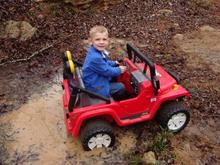 My son Sam "wheelin" in his Jeep. No wonder he's stuck. He wishes it was a Yota.