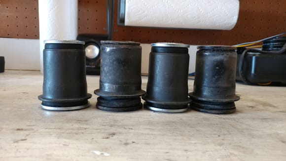 Old bushings next to the new ones.