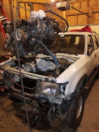 Attempted to put drop motor with out a body lift. Which was a mistake. Was able to slide the motor in with out cutting the front radiator support which was a big plus. However once the motor was in, it was very difficult to get the trans high enough to line up with the motor. Even with motor sitting on the steering well below the motor mounts. So I pulled the 2inch body lift off the black and put on this one. Following day every thing bolted up pretty smooth.