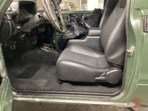 Picture of the standoff distance between seat and floor after modification.