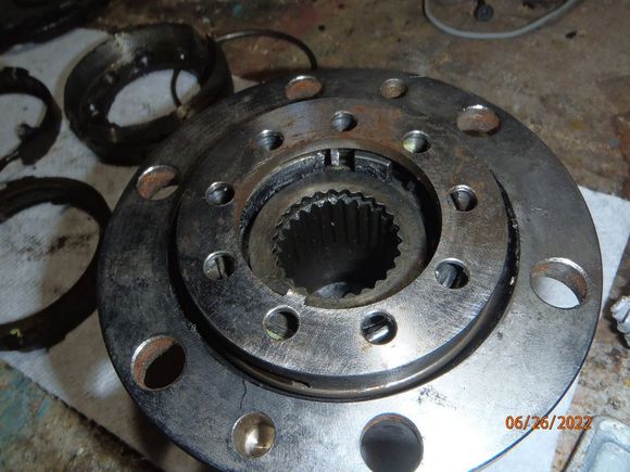 another angle - note the tab on the lock ring.  this rides in a groove on the spindle, and will be at 12 o'clock.  the knockout pins are aligned the same, although from this view, 12 o'clock is at the bottom side of the picture