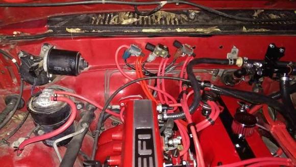 Shot of the engine bay / relocated VSV vacuum switches and new silicone vacuum hoses