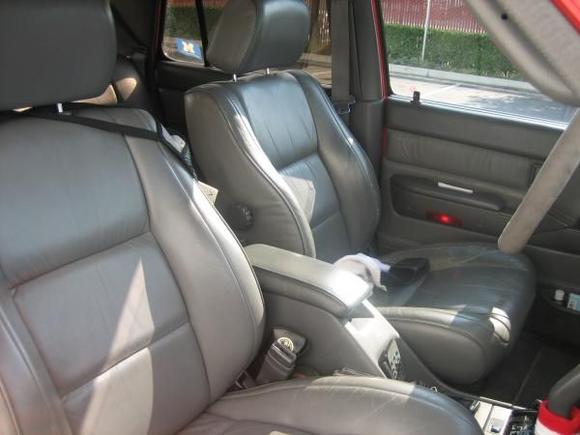 leather . . . it's in pretty decent shape.

Notice the remote control for the Pioneer stereo velcroed to the center console.