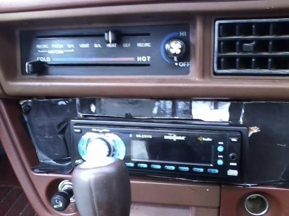 missing piece for stereo deck, previous owner just stuck a piece of cardboard there